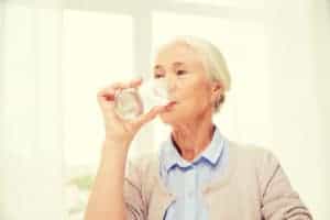 encouraging fluids to prevent dehydration